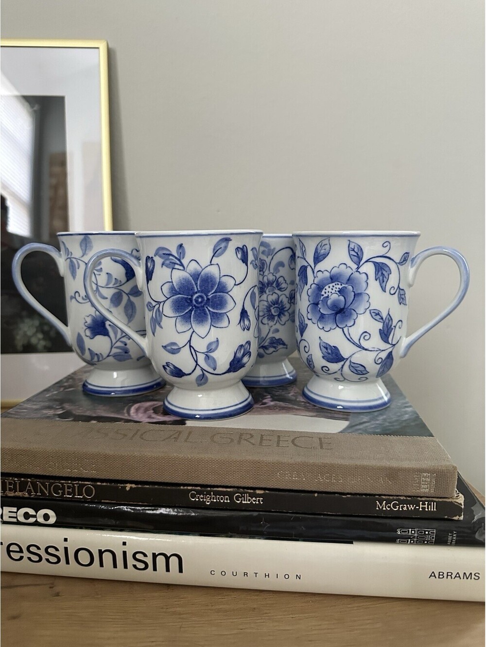 Set Of 4 Blue And White Footed Ceramic Mugs With Floral And Foliage Pattern